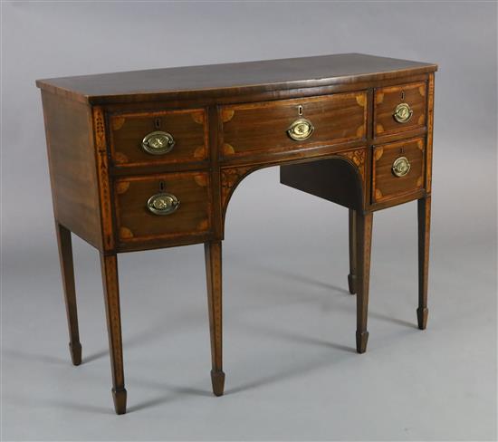 A George III inlaid mahogany bowfront sideboard,fitted five drawers, on squared tapered legs with spade feet, W.111cm D.53.5cm H.86.5cm